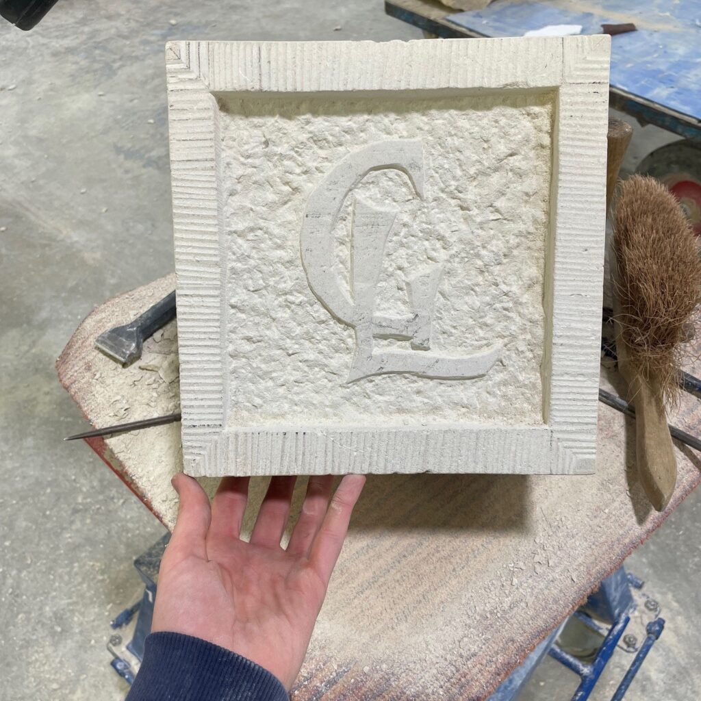 The block has a sunken panel with a drafted margin and sparrow pecked finish.